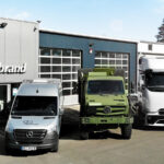 Mercedes-Benz Transporter, UNIMOG und Lkw vor der Herbrand Werkstatt in Wesel.